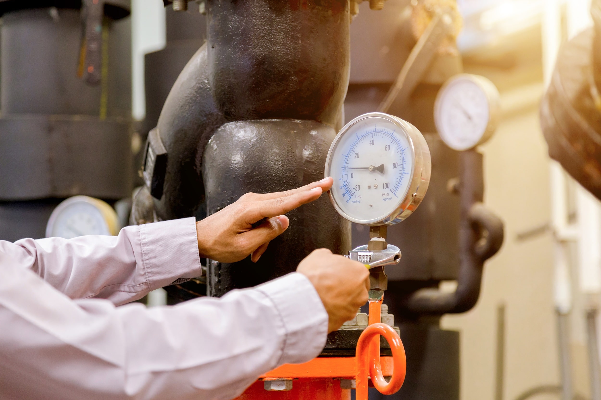 engineer-checking-condenser-water-pump-pressure-gauge