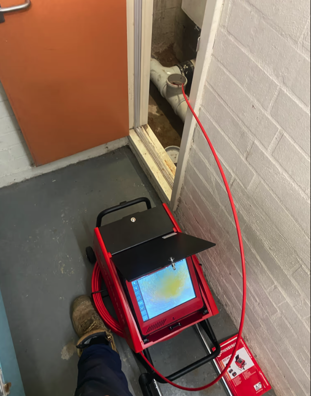 CCTV drain inspection equipment being used to inspect underground pipework at a commercial property.