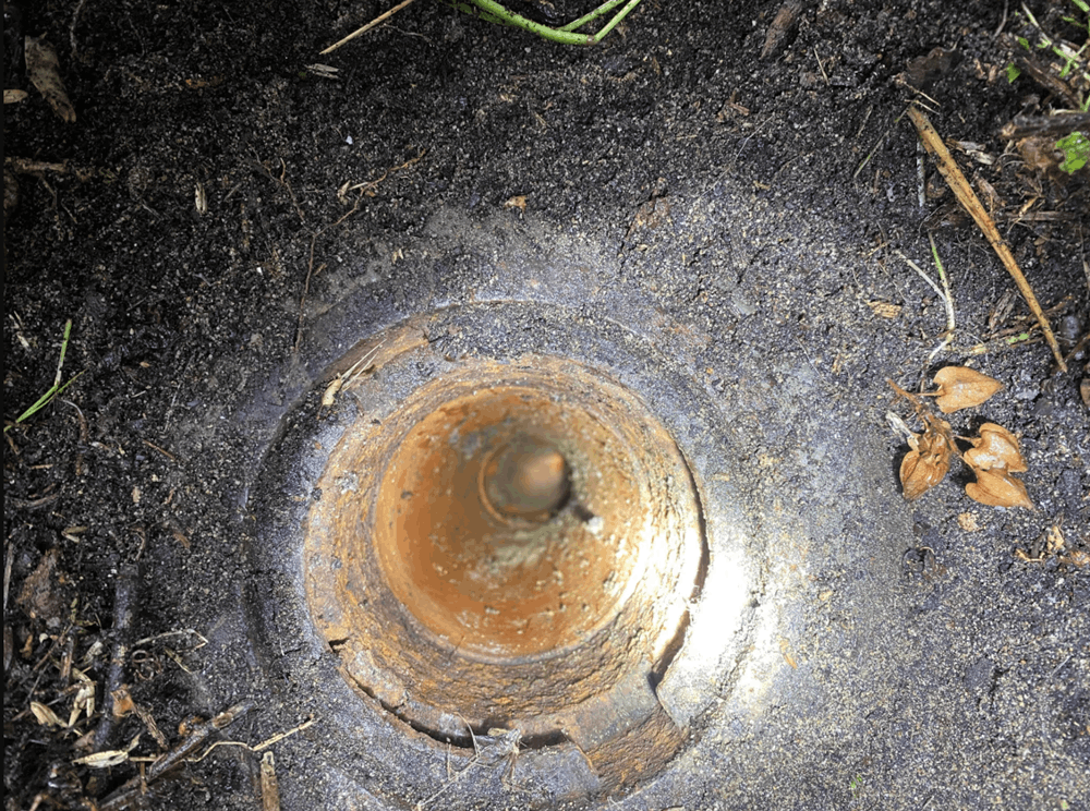 Exposed underground drainage pipe during inspection of commercial pipework